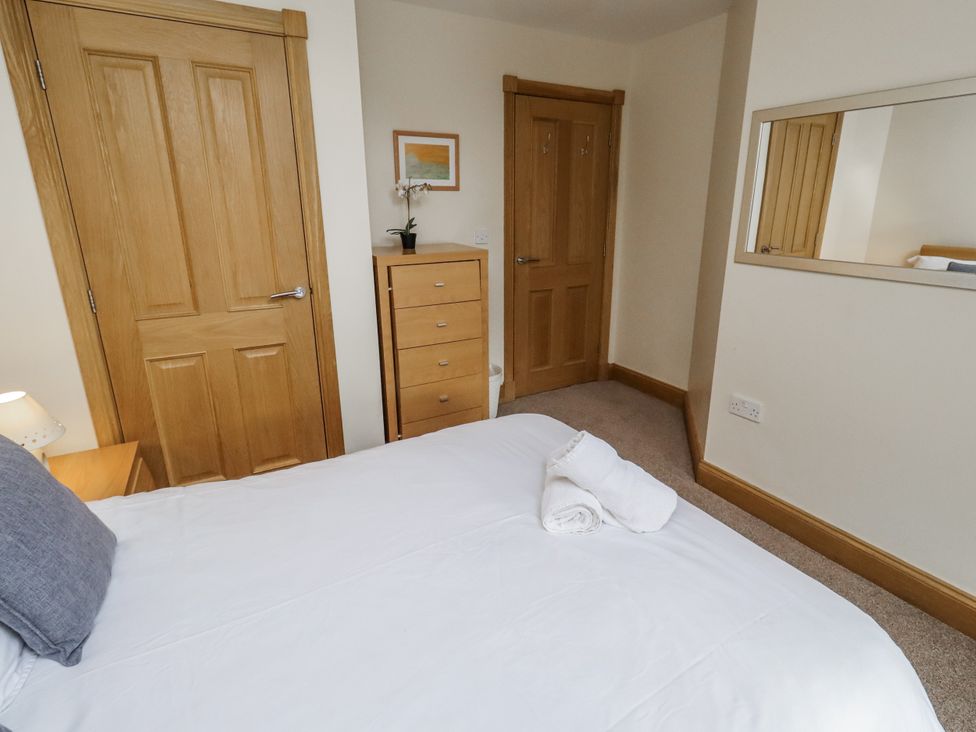 A bedroom with a bed and drawer unit at Low Croft in Embleton