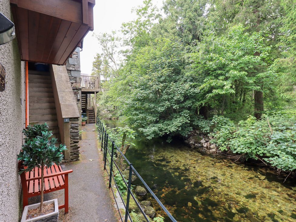 An outdoor pathway with stairs and a stream located at Drystones in Grasmere