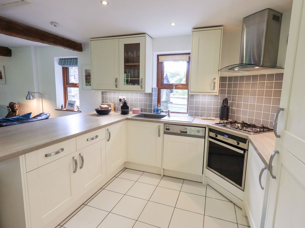 A kitchen with cabinets and appliances at Drystones in Grasmere