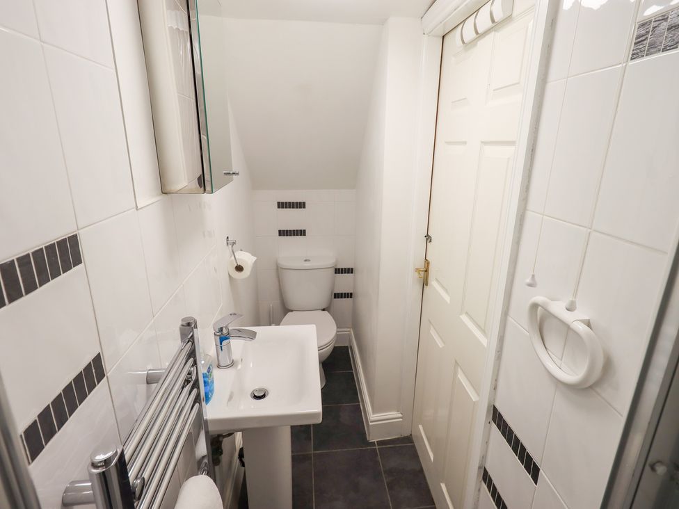 A bathroom with a toilet and sink at Drystones Grasmere