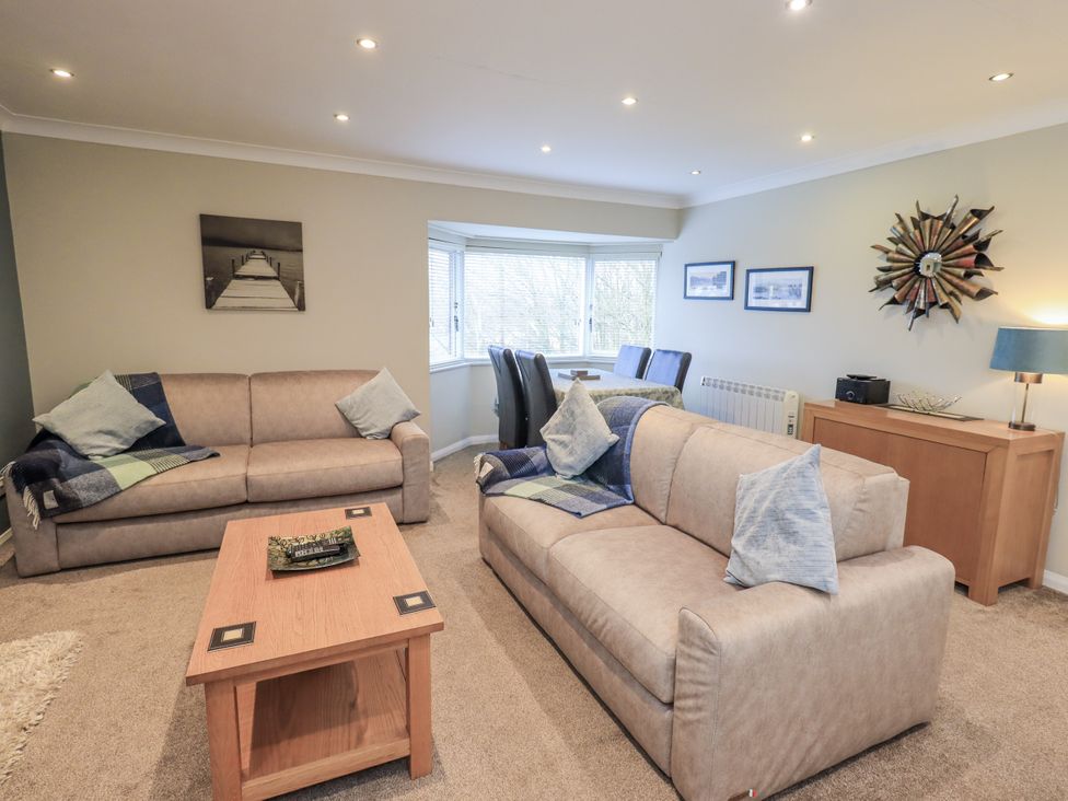 A living room with sofas and a coffee table at Lakeland Loft in Windermere