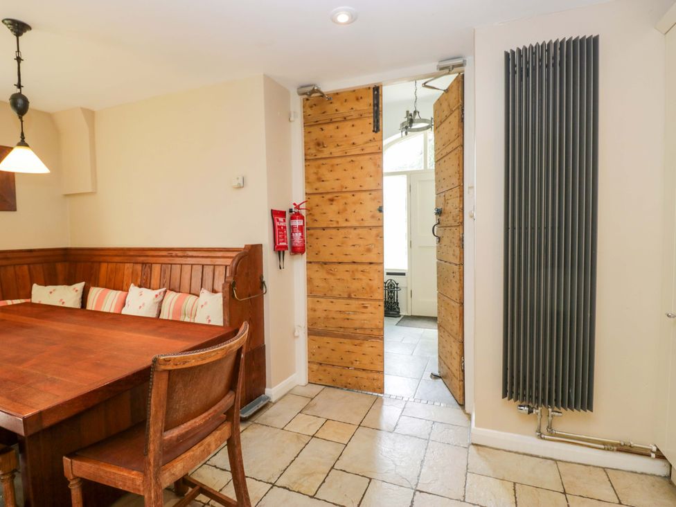A dining room with a table and chairs at Chapel How in Ambleside