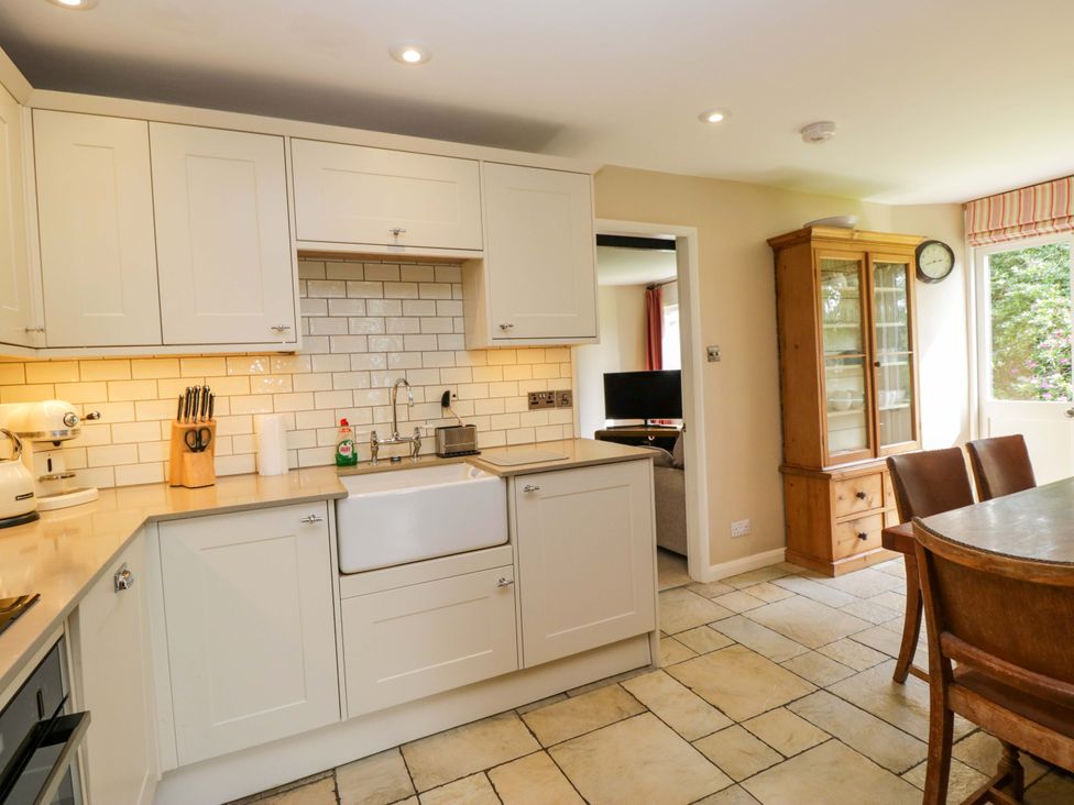 A kitchen with cabinets and a sink at Chapel How Ambleside