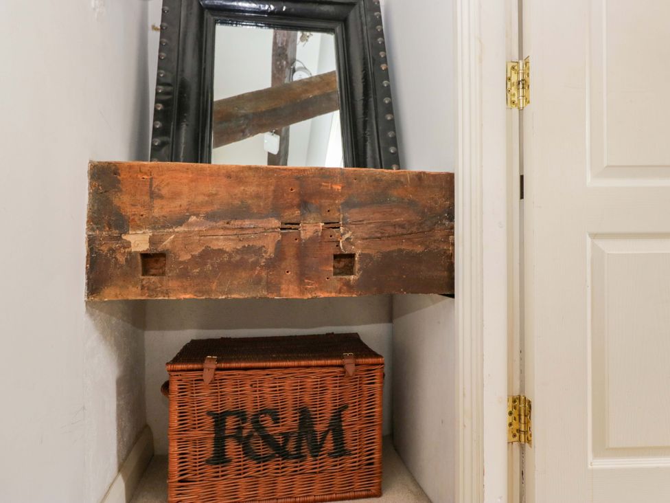 A nook with a wooden shelf and a woven basket at Chapel How Ambleside