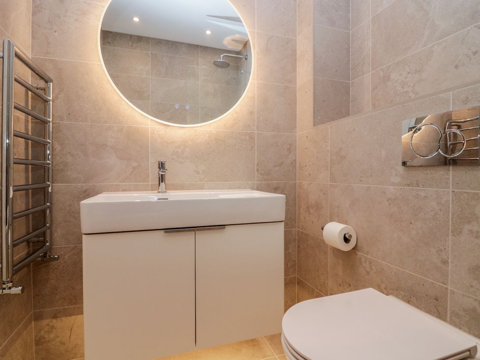 A bathroom with a sink and toilet at Chapel How in Ambleside