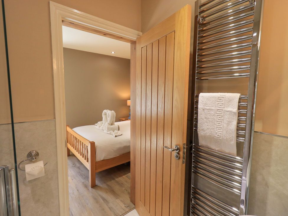 A view of a bathroom leading to a bedroom at Abbots Reading Mews 1 in Grizedale