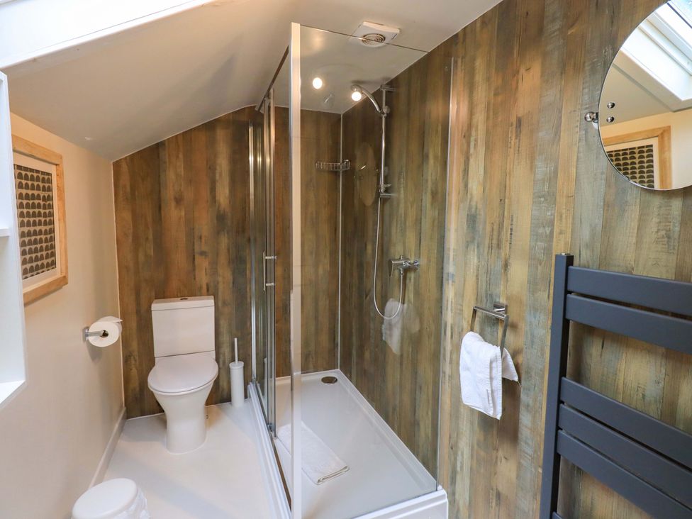 A bathroom with a shower and toilet at Underheron in Grasmere