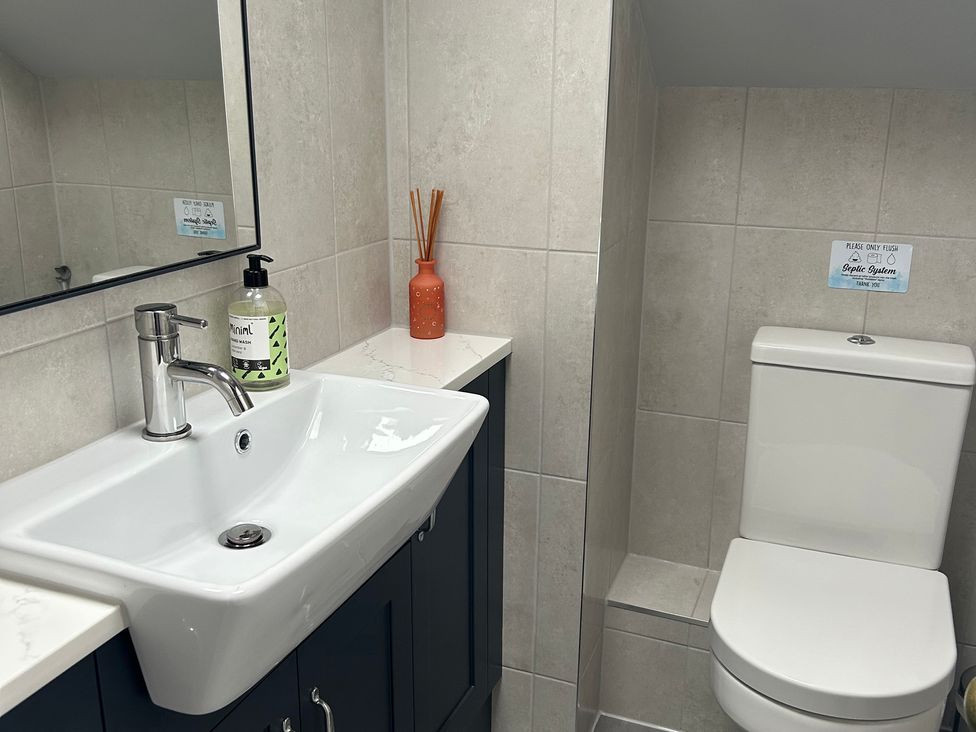 A bathroom with a sink and toilet at The Smithy in Keswick