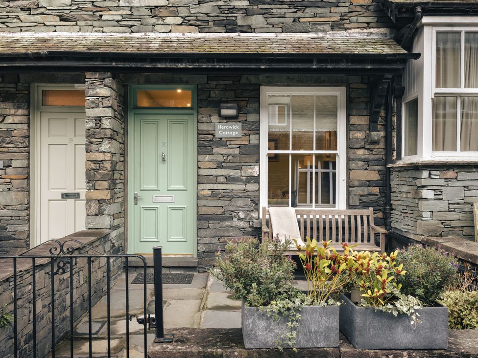 An outdoor view featuring doors and planters at Herdwick Cottage Ambleside