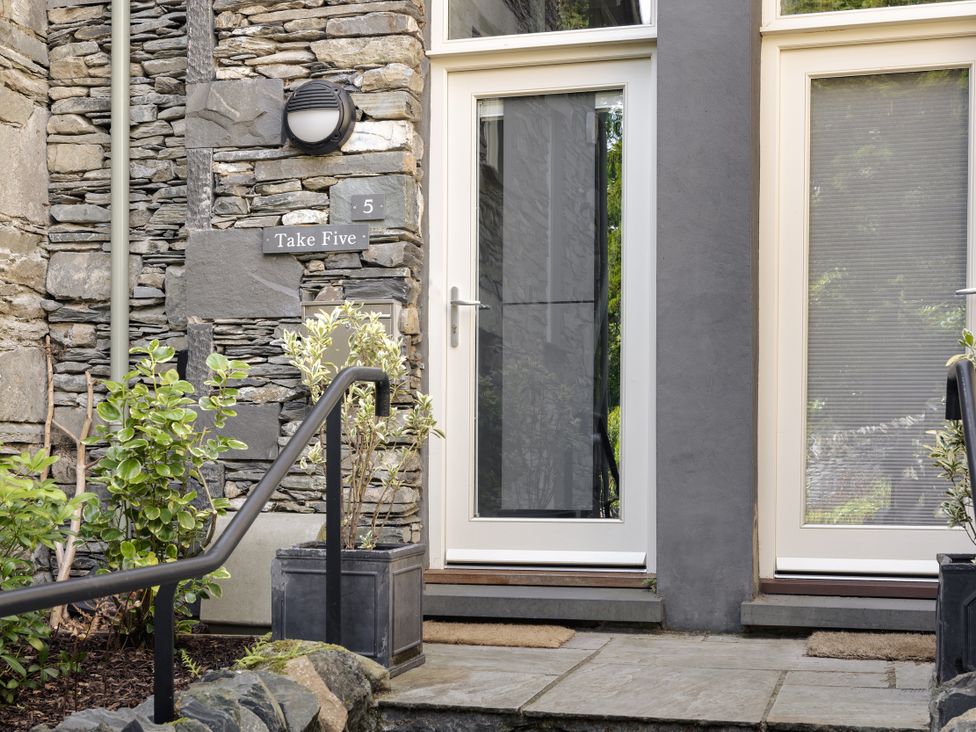 Entrance with a door and plants at Take Five in Ambleside