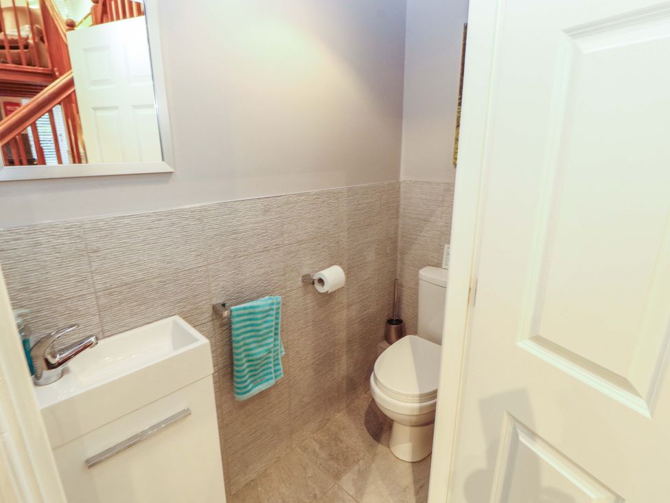 A bathroom with a sink and toilet at Cragfell Cottage Cartmel Fell