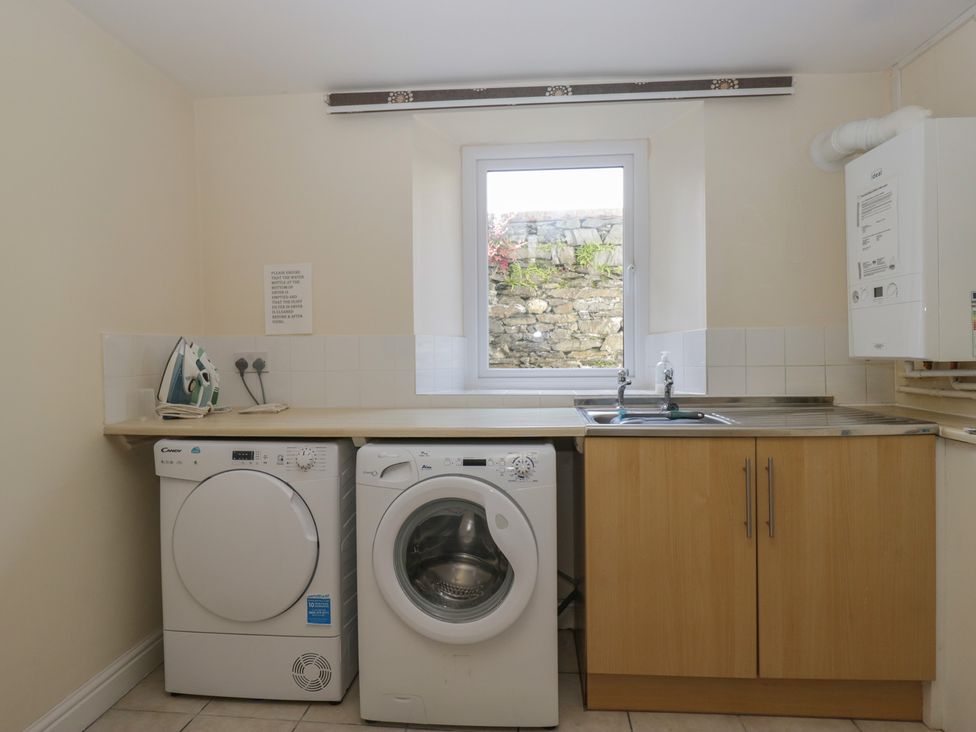 A laundry room with a washing machine and dryer at Woodside West in Bowness