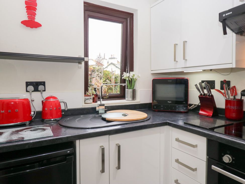 A kitchen with appliances and utensils at Corner Cottage in Troutbeck
