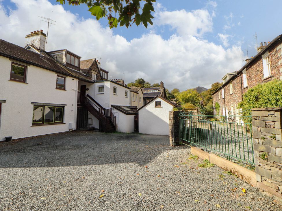 An outdoor area with buildings and gravel at High Raise in Grasmere