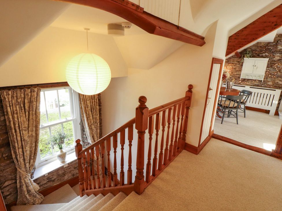 A staircase leading to a dining area at High Raise in Grasmere