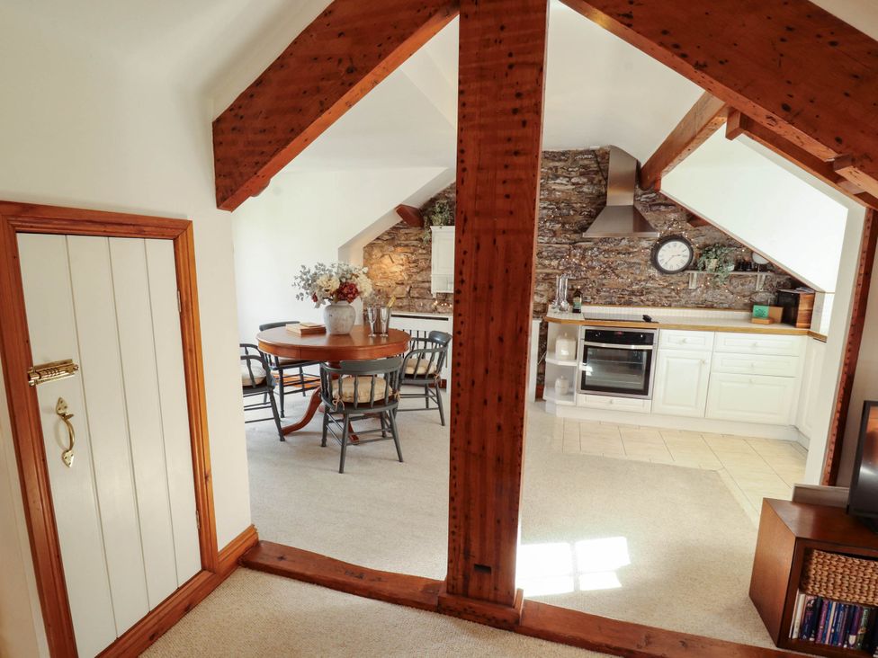 A kitchen with dining area and appliances at High Raise in Grasmere