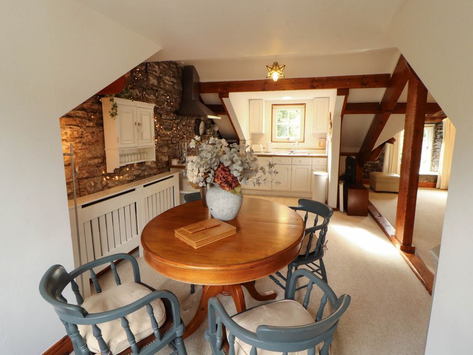 A dining room with a table and chairs at High Raise in Grasmere