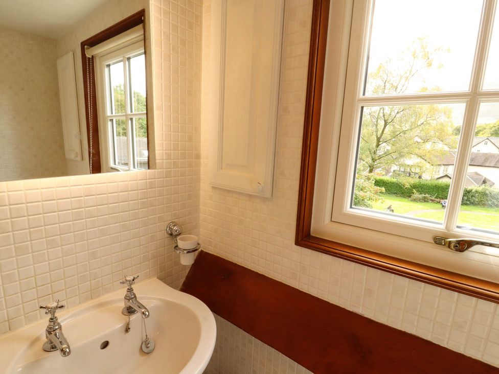 A bathroom with a sink and window at High Raise in Grasmere