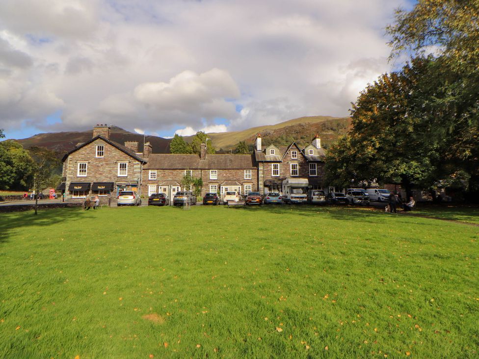 A building with cars parked outside at High Raise in Grasmere