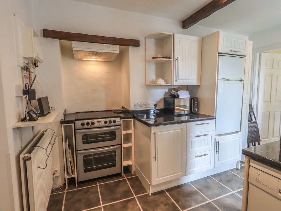 A kitchen with appliances and storage at A River Runs By Staveley