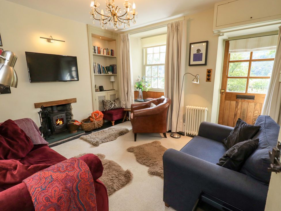 A living room with a TV and fireplace at Beck Steps Chapel Stile