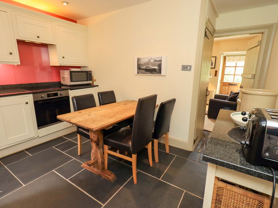 A kitchen with dining table and chairs at Beck Steps in Chapel Stile