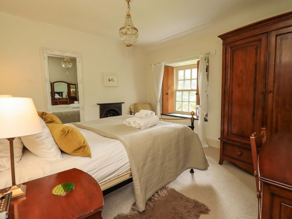 A bedroom with a bed and window at Beck Steps in Chapel Stile