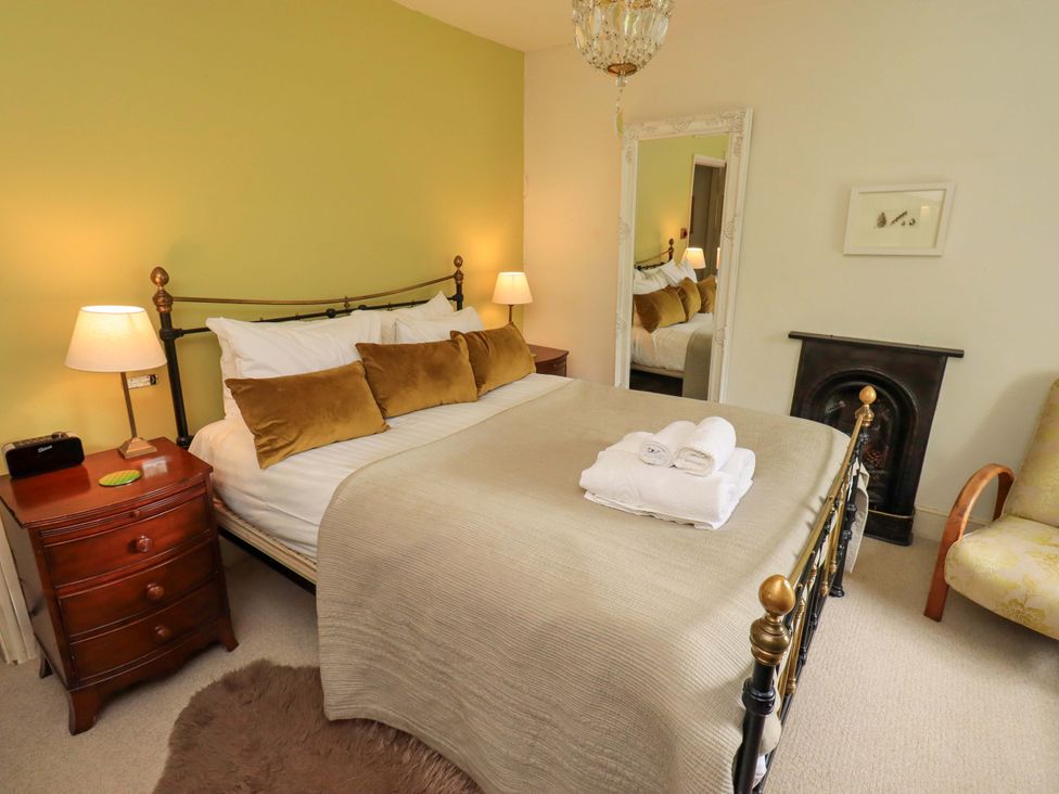 A bedroom with a bed and bedside table at Beck Steps in Chapel Stile