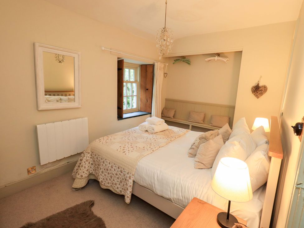A bedroom with a bed and a window at Beck Steps in Chapel Stile