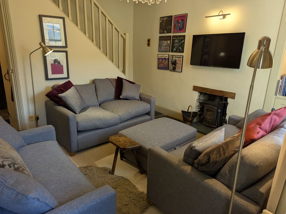 A living room with sofas and a television at Beck Steps in Chapel Stile