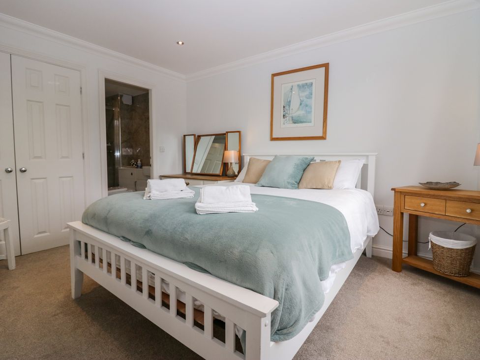 A bedroom with bed and side table at Middlerigg in Troutbeck