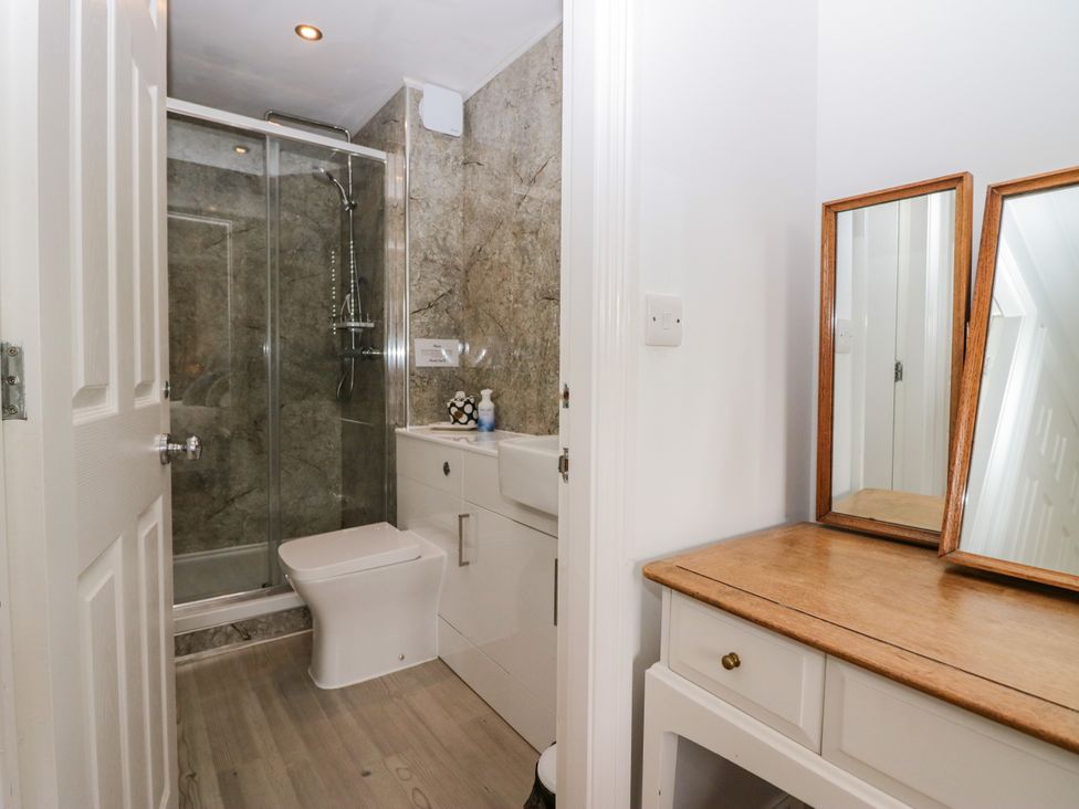 A bathroom with a shower and sink at Middlerigg in Troutbeck