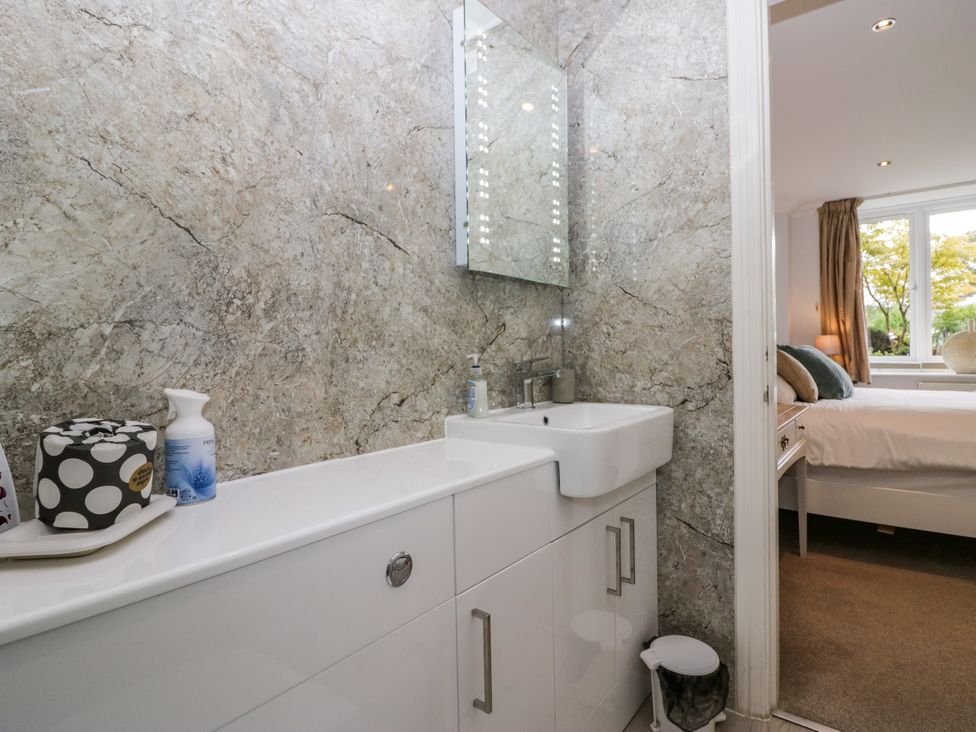 A bathroom with a sink and mirror at Middlerigg in Troutbeck