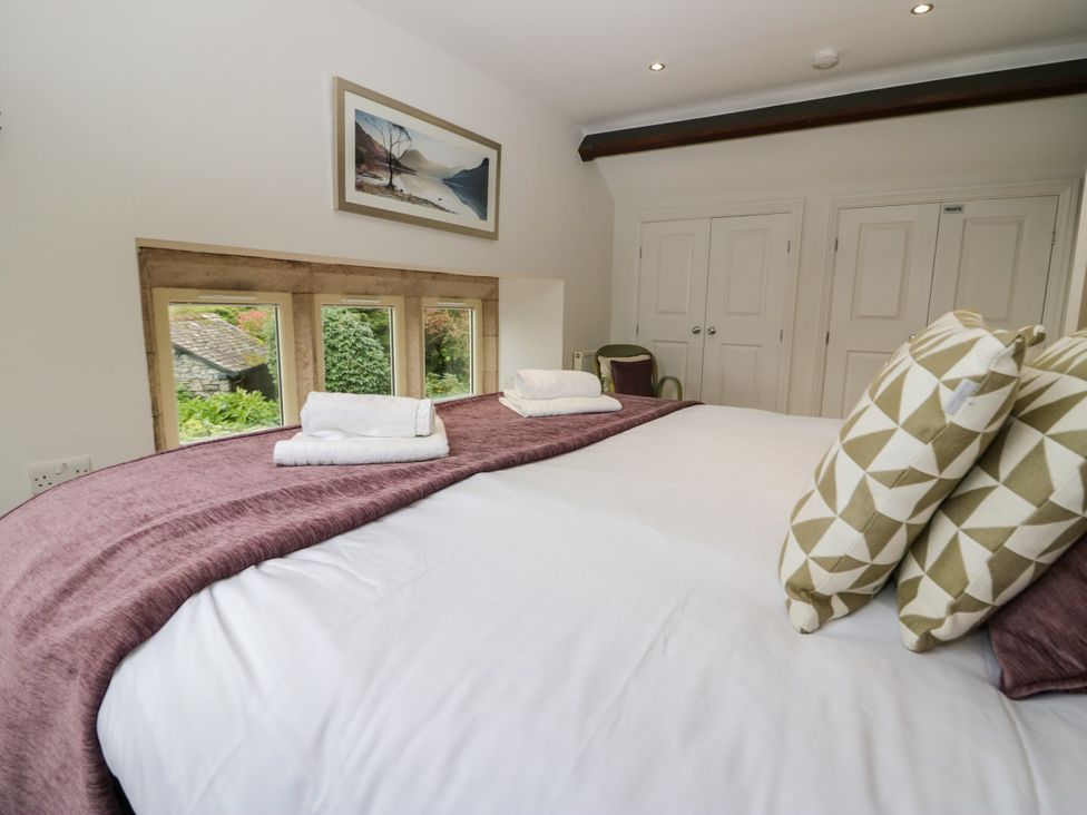 A bedroom with a bed and pillows at Middlerigg in Troutbeck