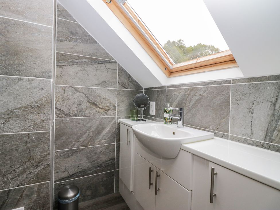 A bathroom with a sink and mirror at Middlerigg in Troutbeck