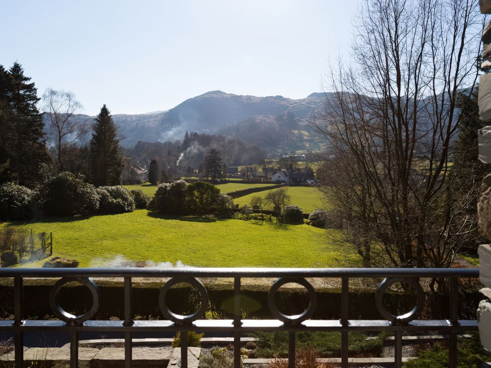 A view of fields and mountains at Fairfield Cottage in Grasmere