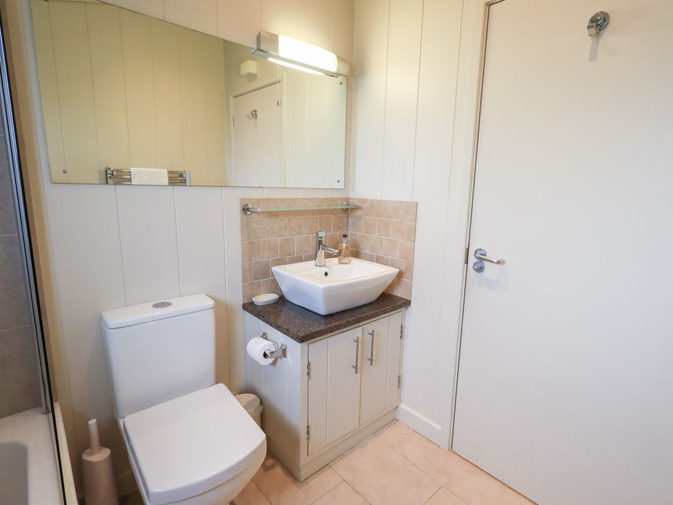 A bathroom with a sink and toilet at The Loghey in Hawkshead