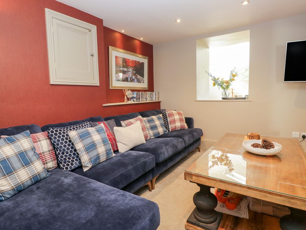 A living room with a sofa and a coffee table at Archie's in Ambleside