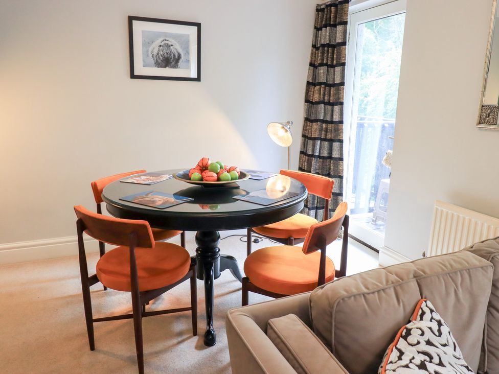 A dining room with a table and chairs at Ghyll Heights in Ambleside