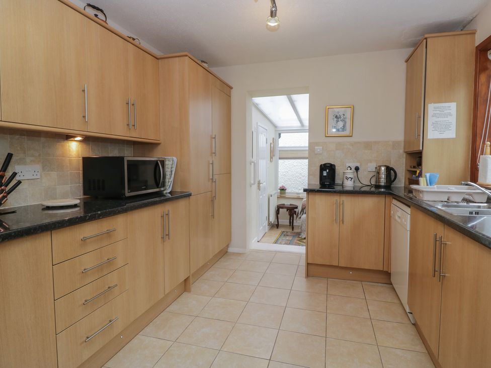 A kitchen with appliances and cabinets at Redwood in Ambleside