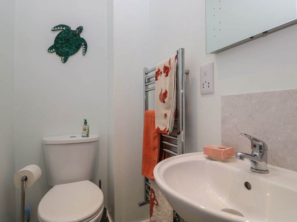 A bathroom with a toilet and sink at Redwood in Ambleside
