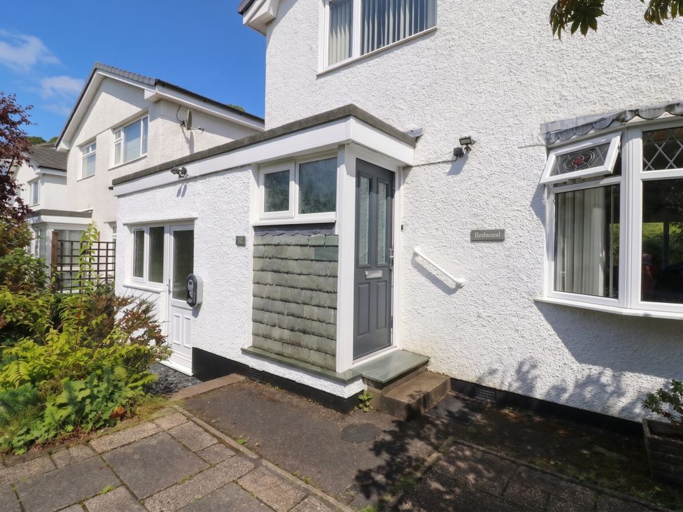 A front entrance with a door and window at Redwood in Ambleside