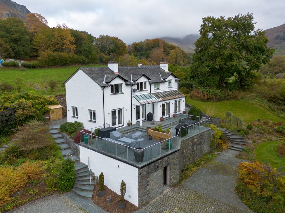 A house with a balcony and garden at Goody Raise in Grasmere