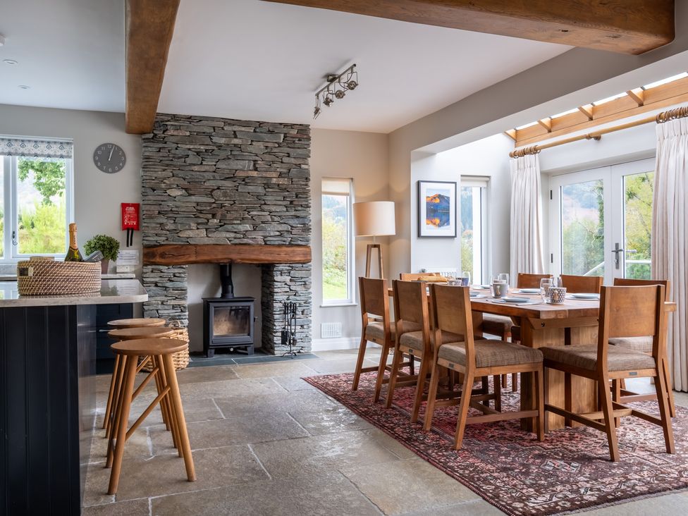 A dining room with a table and chairs at Goody Raise in Grasmere