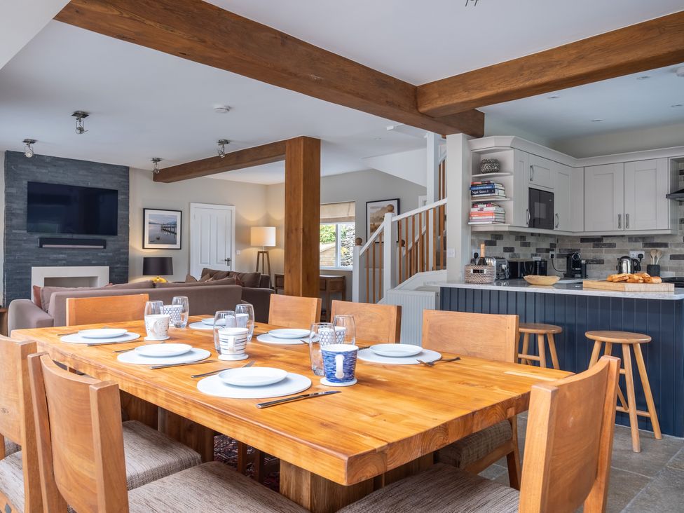 A dining room with a wooden table and chairs at Goody Raise in Grasmere