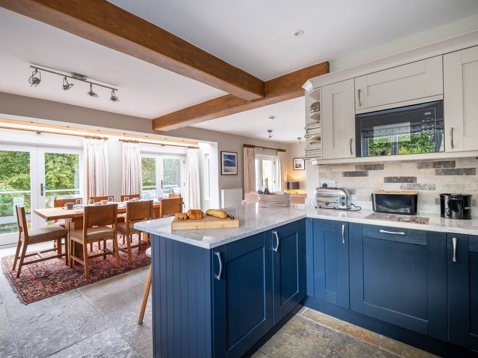 A kitchen featuring a table and chairs at Goody Raise in Grasmere
