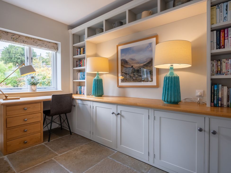 An office with a desk and bookshelf at Goody Raise in Grasmere