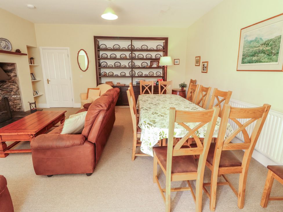 A dining room with a table and chairs at Hawkshead Hall in Hawkshead