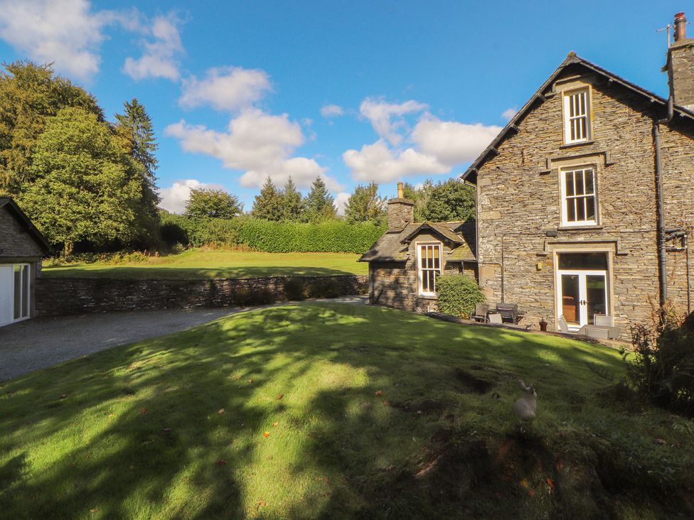 An outdoor view of a house and garden at Hawkshead Hall in Hawkshead