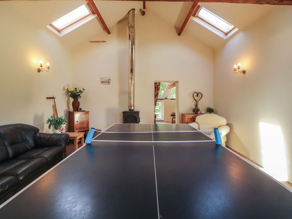 A recreation room with a ping pong table at Hawkshead Hall in Hawkshead